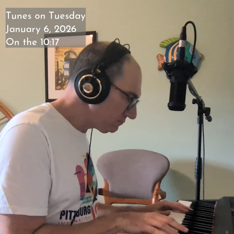 Photo of Oren Levine playing an electric piano and singing. Text at top left reads 'Tunes on Tuesday January 6, 2026; On the 10:17'
