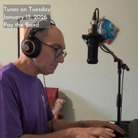 Photo of Oren Levine playing an electric piano. A microphone is suspend in front of him. Text at top left reads 'Tunes on Tuesday January 13, 2026 Pay the Band'